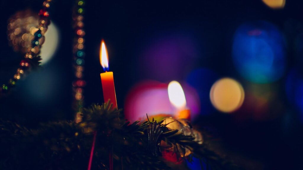 Cozy Christmas Candle Lights with Festive Bokeh Background 4K Wallpaper