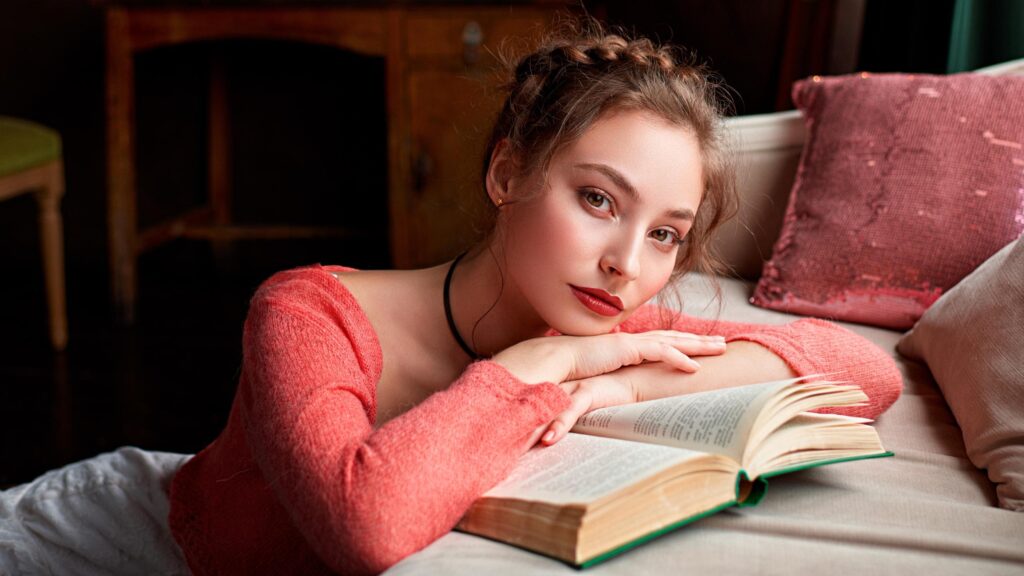 Beautiful Young Woman Reading a Book in a Cozy Interior PC Wallpaper