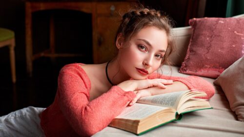 Beautiful Young Woman Reading a Book in a Cozy Interior PC Wallpaper