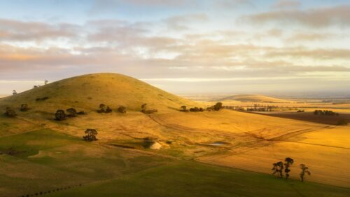 Golden Hour Over Rolling Hills and Farmland Desktop Wallpaper