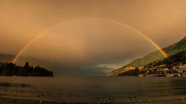 Breathtaking Sunset Rainbow Over Mountain Lake Landscape 4K Wallpaper