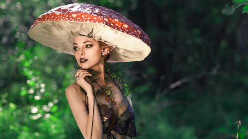Ethereal Forest Elf Wearing a Mushroom Hat Fantasy Desktop Wallpaper