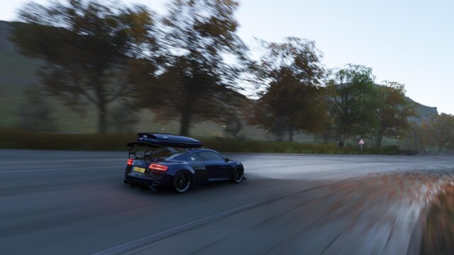 Audi R8 Racing Down a Scenic Country Road with Roof Box PC Wallpaper