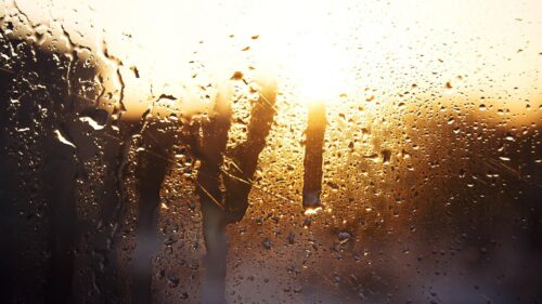 Golden Sunset Through Raindrops on Windowpane Desktop Wallpaper