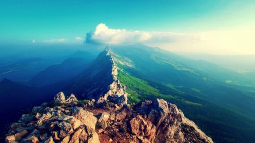 Breathtaking Mountain Ridge View Above the Clouds Desktop Wallpaper