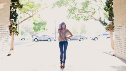 Stunning Woman Standing in Urban Sunlight 4K PC Wallpaper