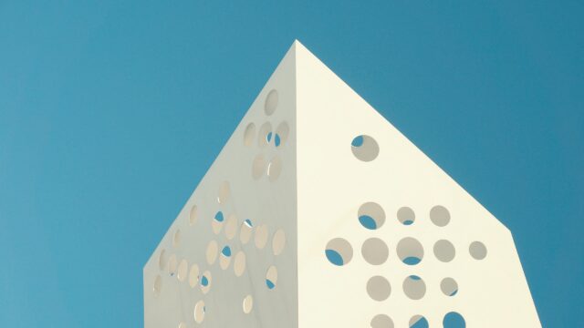 Minimalist Geometric White Structure Against Blue Sky 4K Wallpaper
