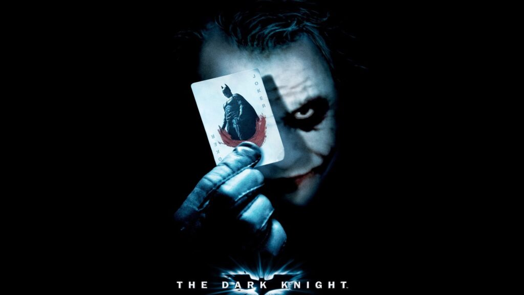 The Joker Holding Batman Playing Card Desktop Wallpaper