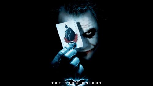 The Joker Holding Batman Playing Card Desktop Wallpaper