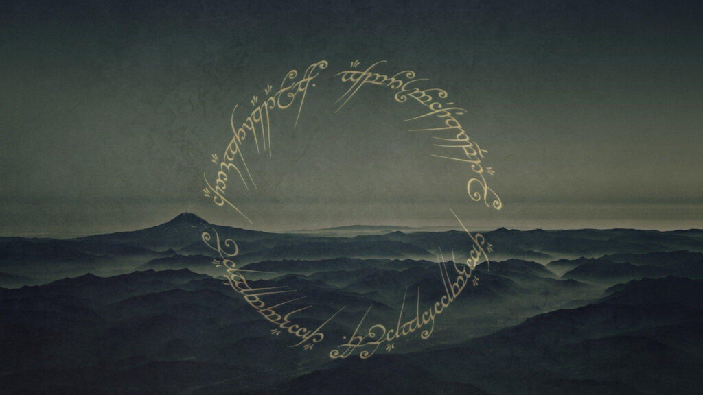 Misty Mountain Landscape with Elvish Script Desktop Wallpaper