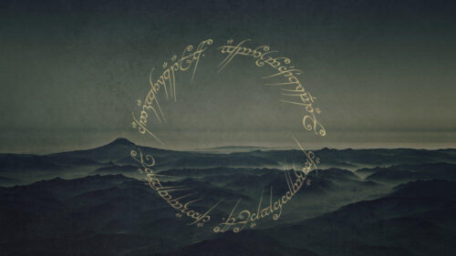 Misty Mountain Landscape with Elvish Script Desktop Wallpaper
