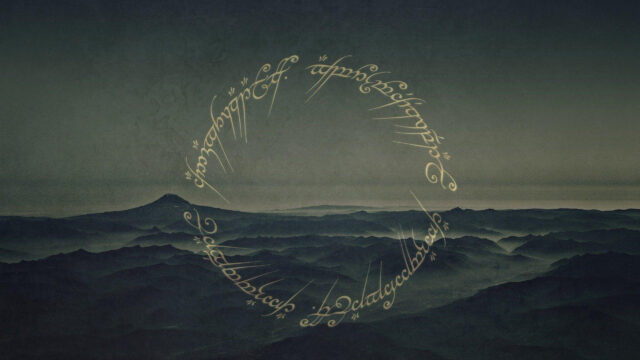 Misty Mountain Landscape with Elvish Script Desktop Wallpaper