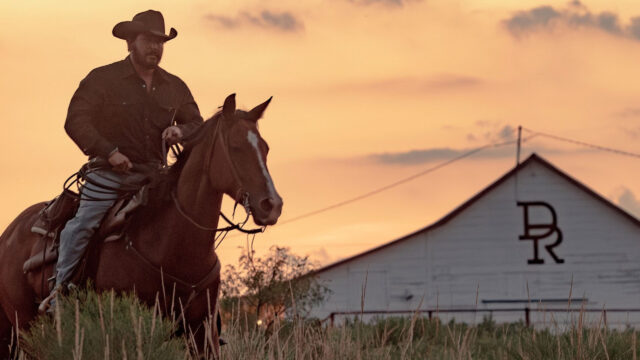 Lone Cowboy Riding at Sunset Desktop Wallpaper