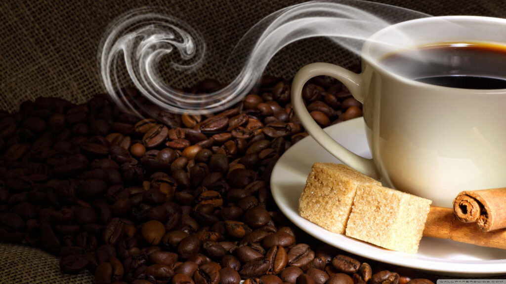 Steaming Cup of Coffee with Beans and Cinnamon Desktop Wallpaper
