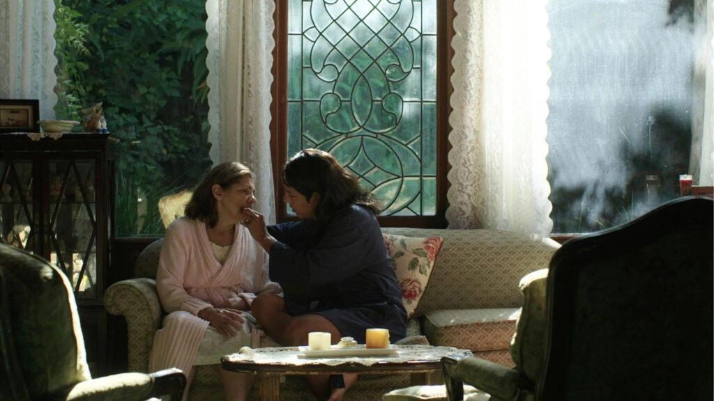 Caring Interaction in a Sunlit Living Room Desktop Wallpaper