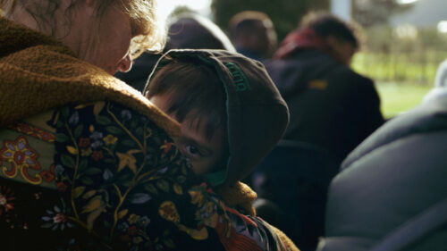 Child Seeking Comfort in Mother’s Embrace Desktop Wallpaper