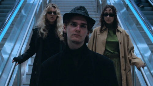 Fashionable Trio on Escalator 4K Desktop Wallpaper