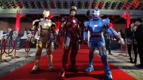 Iron Man Cosplay Performance on Red Carpet Desktop Wallpaper