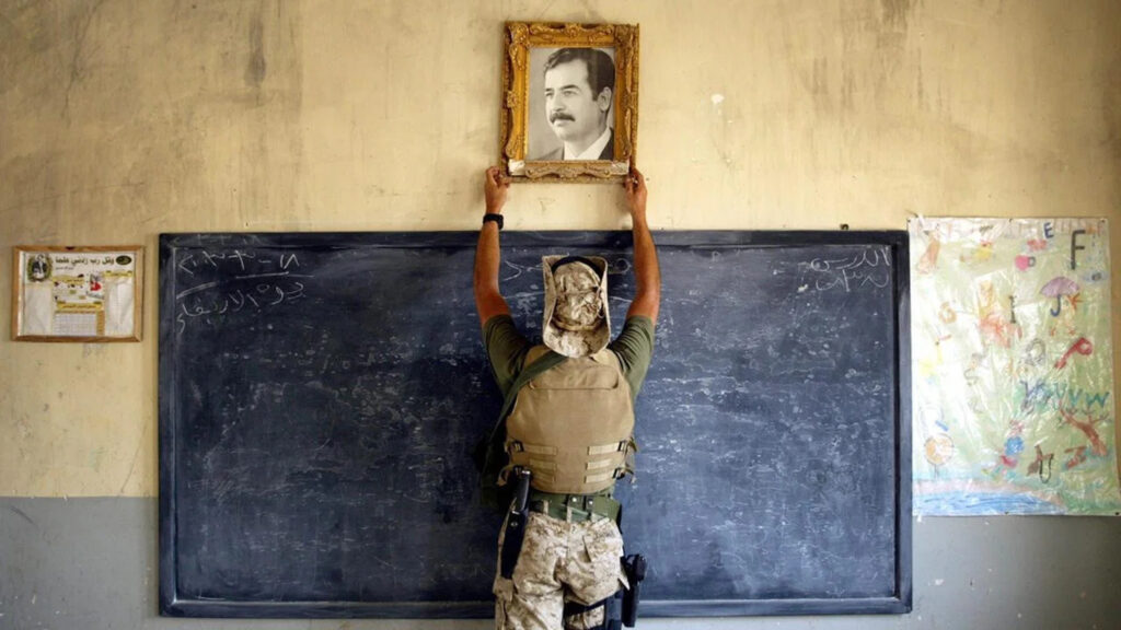 US Soldier Removing Saddam Hussein Portrait Desktop Wallpaper