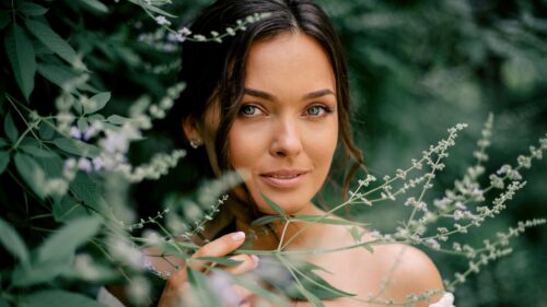 Beautiful Woman Surrounded by Nature Portrait 4K Wallpaper