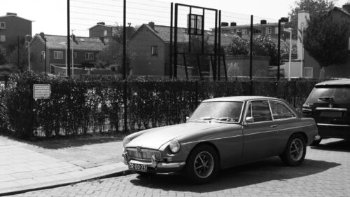 Vintage MG B GT Sports Car on a Sunny Dutch Street Desktop Wallpaper