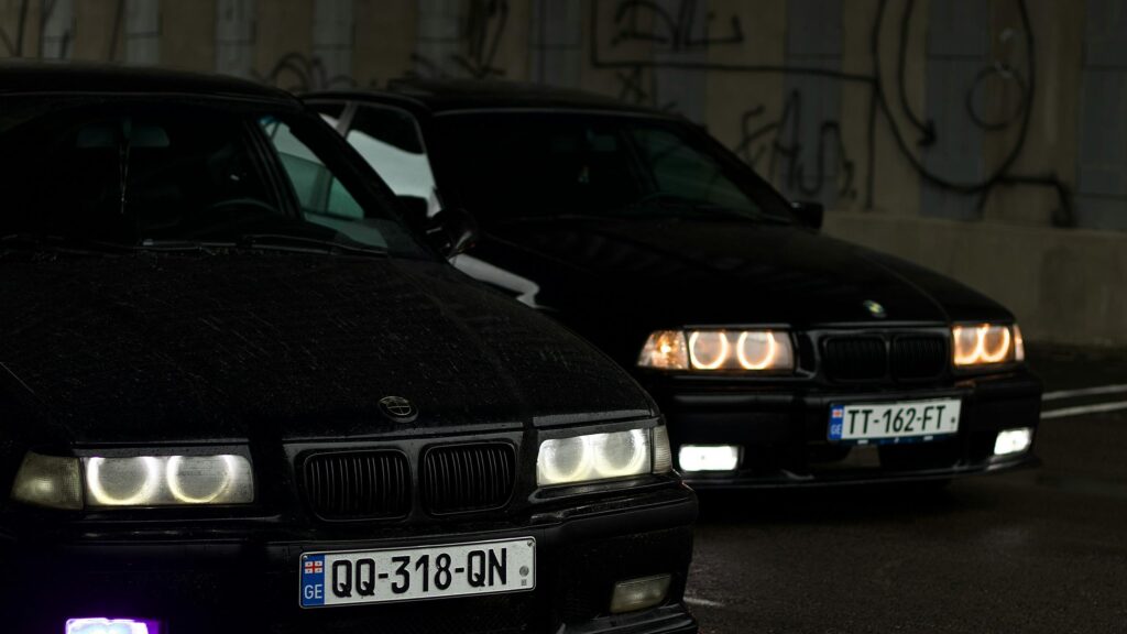 Two Black BMW E36 Sport Cars Parking at Night 4K Desktop Wallpaper