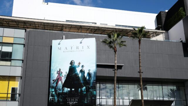 The Matrix Resurrections Movie Poster Billboard on Building 4K Desktop Wallpaper