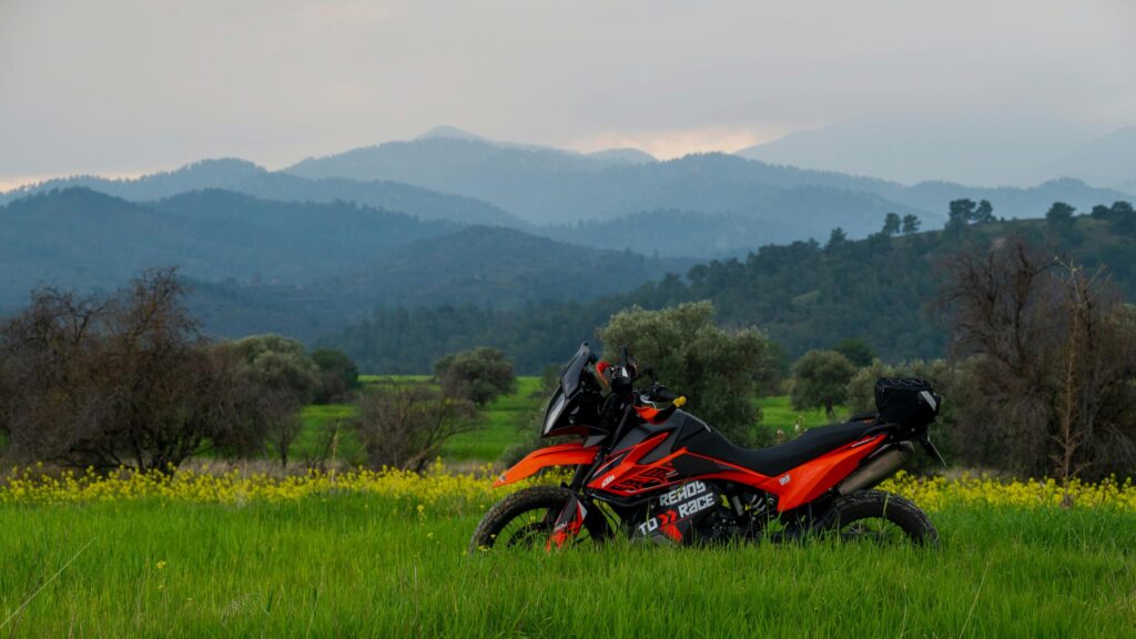 KTM Adventure Motorcycle in Wildflower Field Desktop Wallpaper