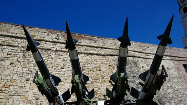 Military Rockets Against Ancient Fortress Walls 4K Wallpaper
