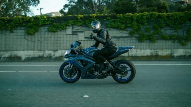 Blue Suzuki Sportbike Rider Giving Thumbs Up 4K Desktop Wallpaper