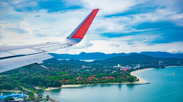 Stunning Aerial View of Tropical Island Coastline Plane Wing 4K Wallpaper