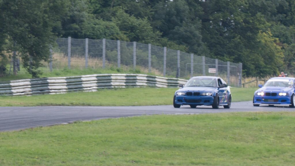 Blue BMW Drift Cars Racing on Track Circuit Desktop Wallpaper