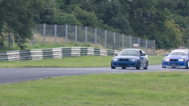 Blue BMW Drift Cars Racing on Track Circuit Desktop Wallpaper