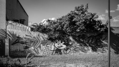 Grayscale Street Art Mural with Cartoon Character Desktop Wallpaper