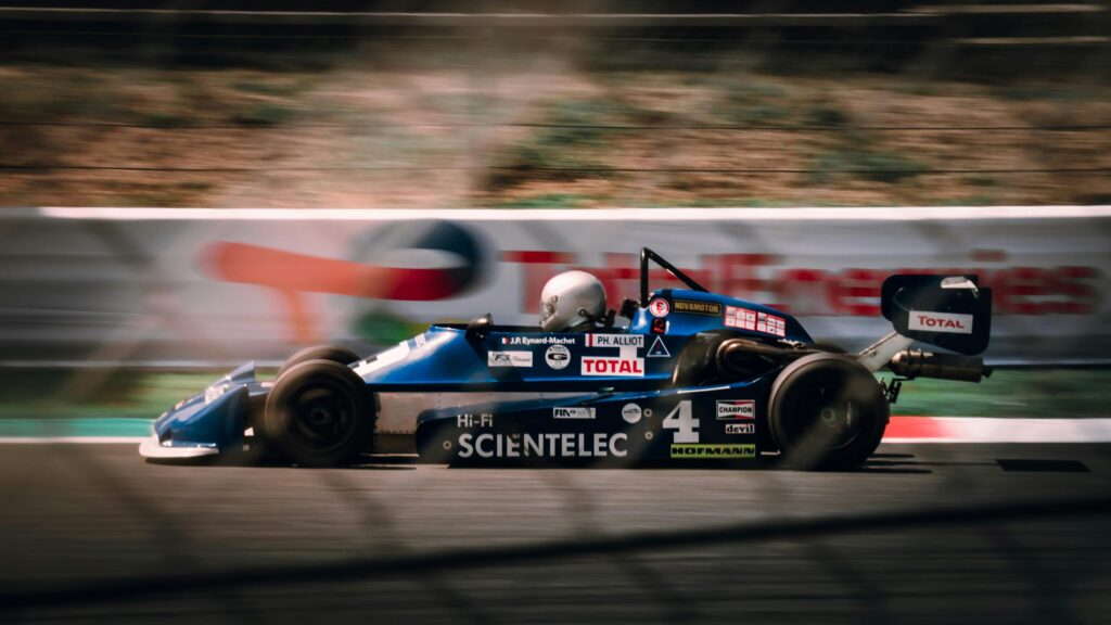 Vintage Martini Racing Formula 3 Car Speeding on Track Desktop Wallpaper