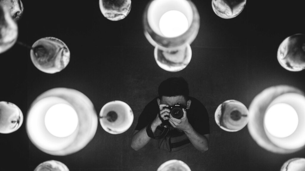 Photographer Taking a Picture Through Abstract Lights Desktop Wallpaper