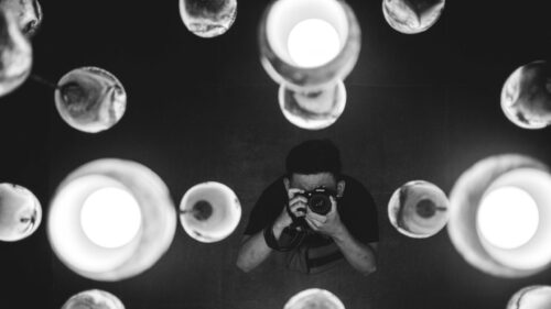 Photographer Taking a Picture Through Abstract Lights Desktop Wallpaper