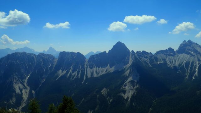 Stunning Dolomite Mountain Peaks Under Blue Sky Desktop Wallpaper