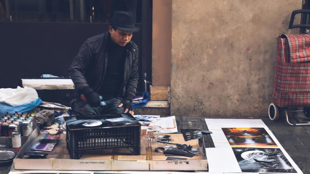 Street Artist Spray Painting a Cosmic Scene Desktop Wallpaper