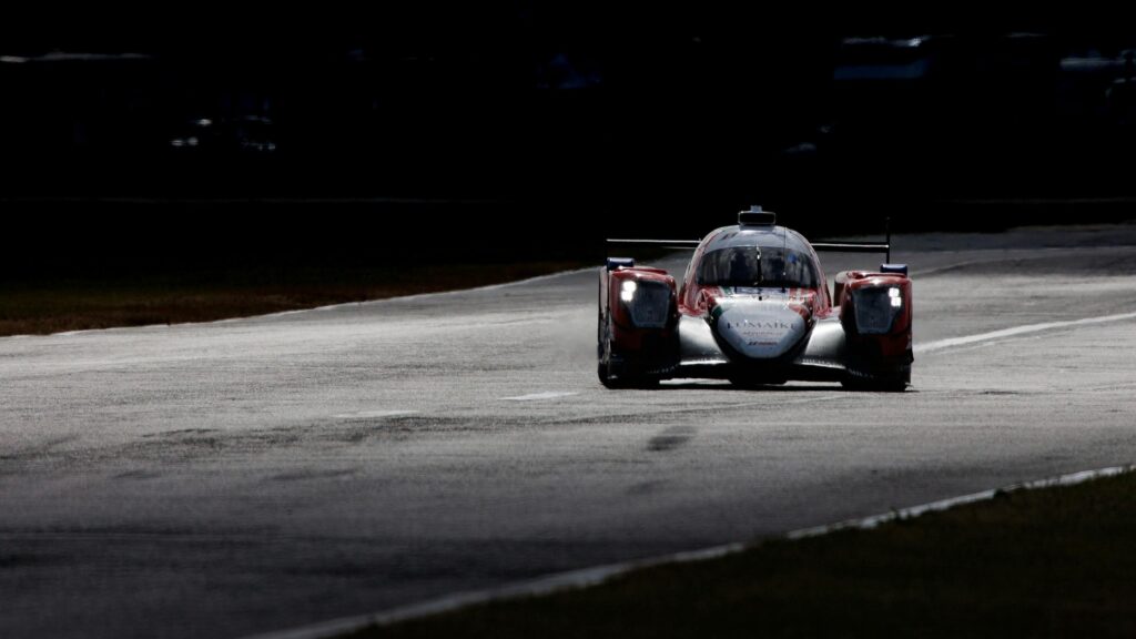 Dramatic Racing Car Speeding on Racetrack 4K Desktop Wallpaper