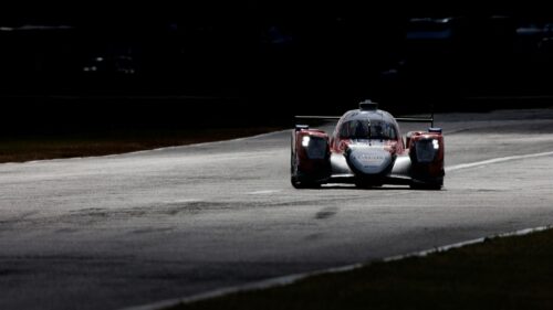 Dramatic Racing Car Speeding on Racetrack 4K Desktop Wallpaper