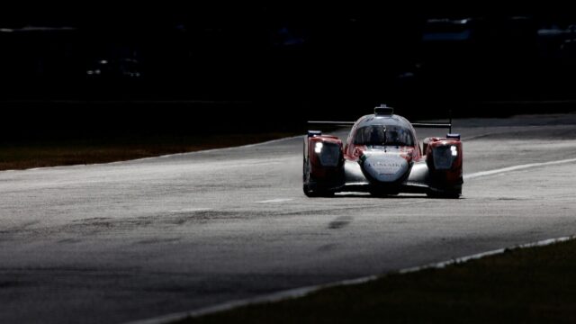 Dramatic Racing Car Speeding on Racetrack 4K Desktop Wallpaper