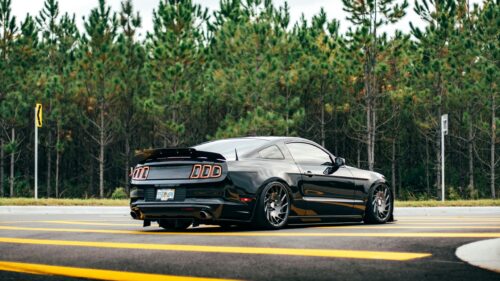 Modified Black Ford Mustang S197 Coupe 4K Desktop Wallpaper