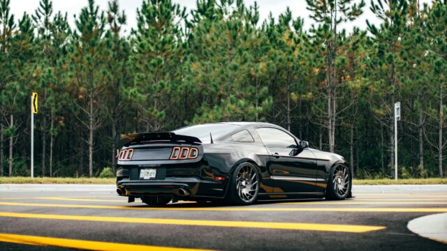 Modified Black Ford Mustang S197 Coupe 4K Desktop Wallpaper