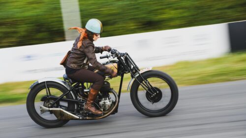 Vintage Triumph Motorcycle Rider in Motion High Quality PC Wallpaper