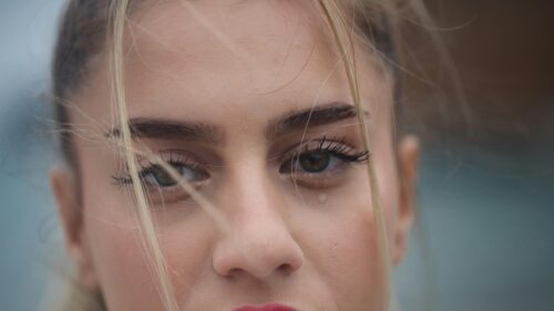 Sad Blonde Girl Crying with Windblown Hair Close-up 4K Desktop Wallpaper