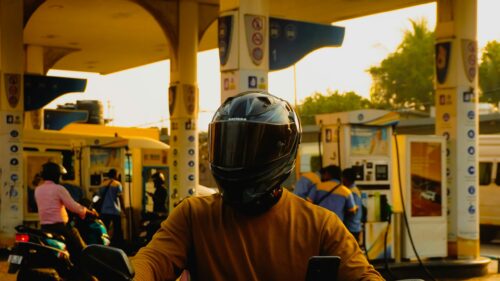 Biker in Helmet at Gas Station Sunset 4K Desktop Wallpaper
