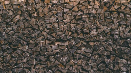 Rustic Stacked Firewood Texture Close-up 4K Desktop Wallpaper