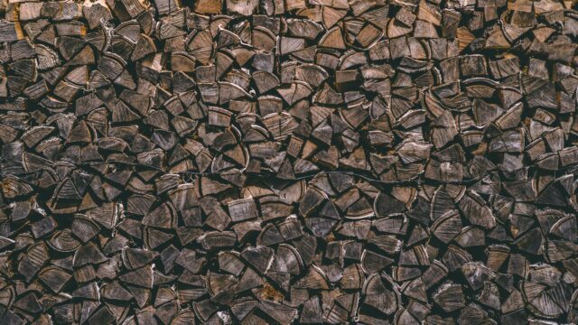 Rustic Stacked Firewood Texture Close-up 4K Desktop Wallpaper