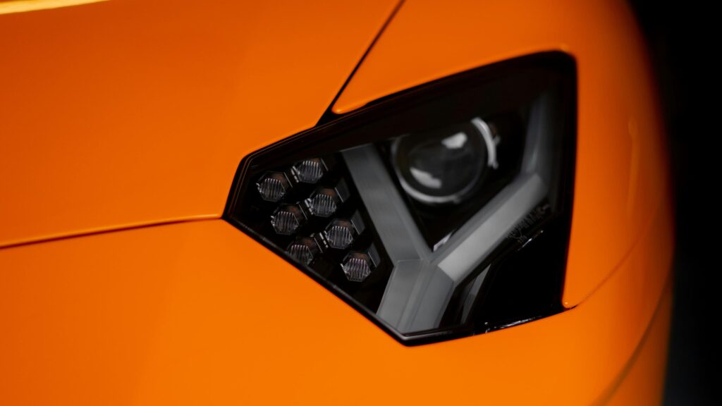 Close-up Lamborghini Aventador Orange Headlight 4K Wallpaper